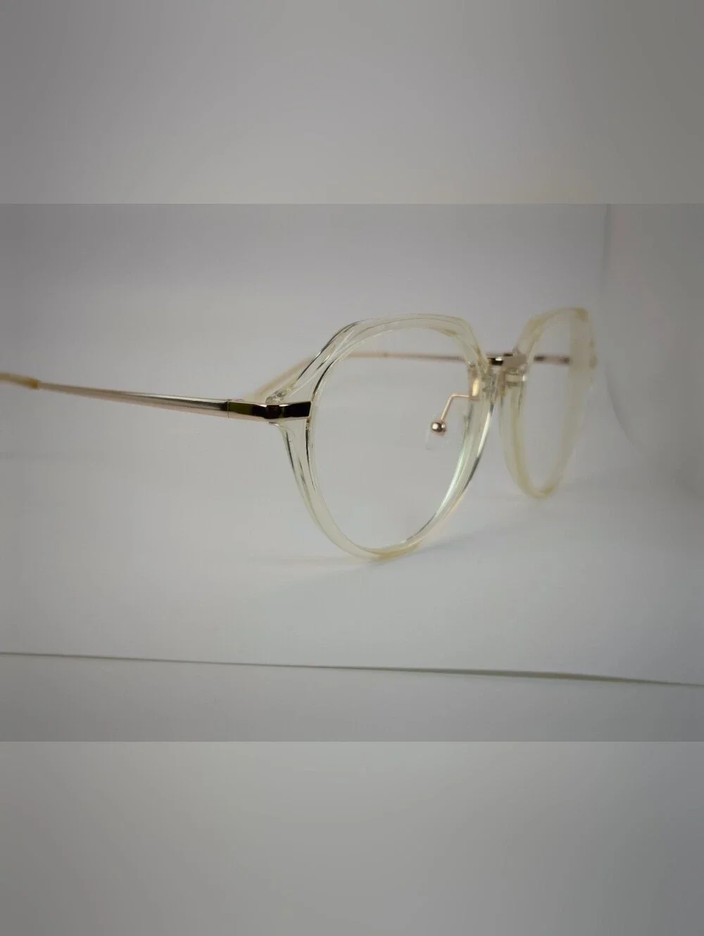 Tamara. Clear Round Frame Glasses with Gold Accents. Nose Pads. Metal Bridge